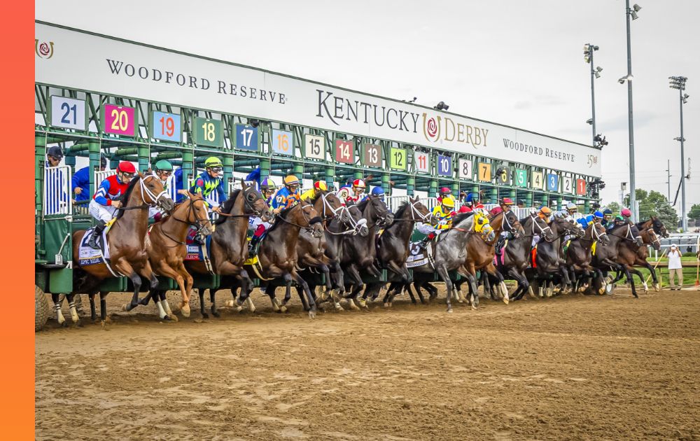 Twenty one racehorses starting to run from the starting gate at the Kentucky Derby.