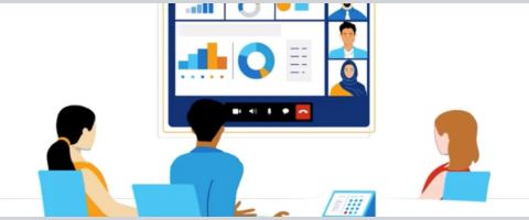 An illustration of co-workers in a meeting room at a table communicating with a video call on a large screen in front of them