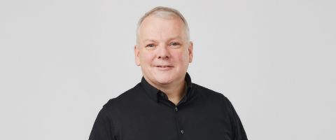 Professional headshot of Jim Fowler, committee member